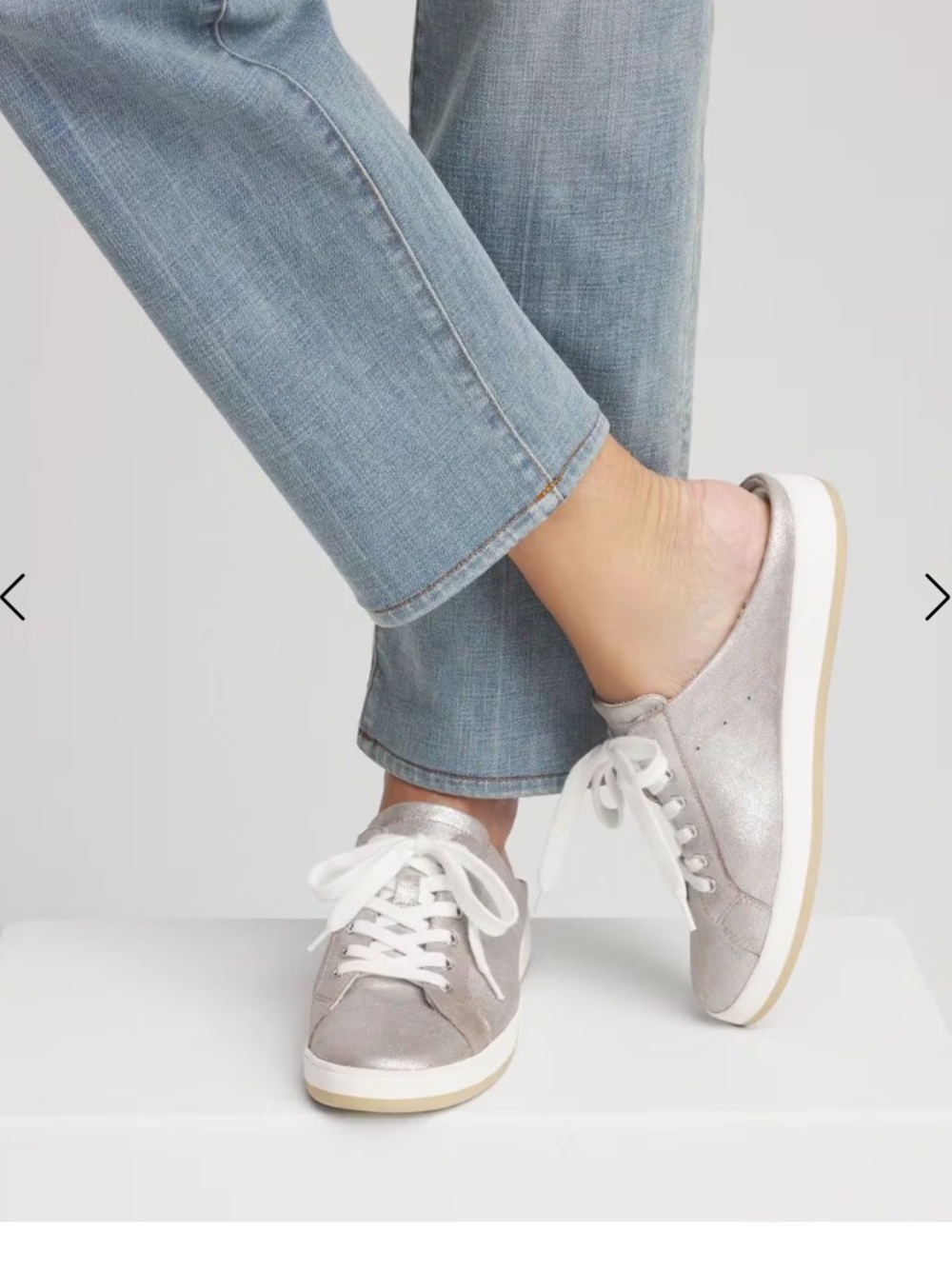 Chico's metallic silver slip-on sneakers with a shimmer upper and white laces.